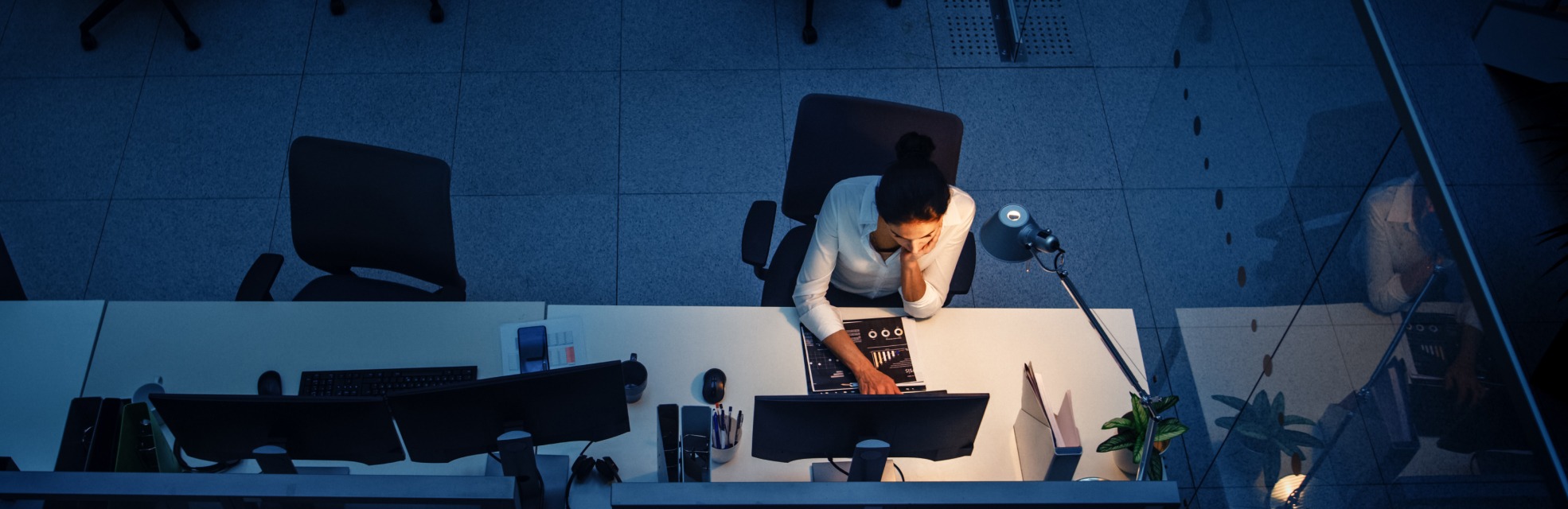 person working at a desk to represent the most common expense report mistakes